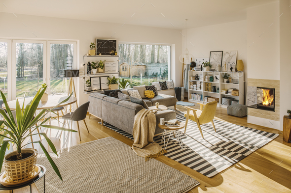 Two carpets on the floor in white Scandi living room interior wi - Stock Photo - Images