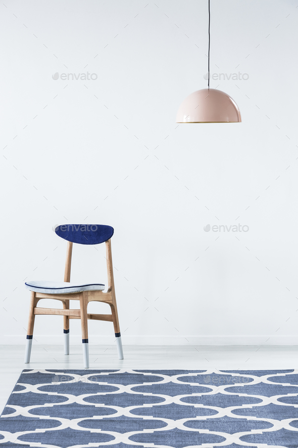 Paint-dipped chair in white interior - Stock Photo - Images