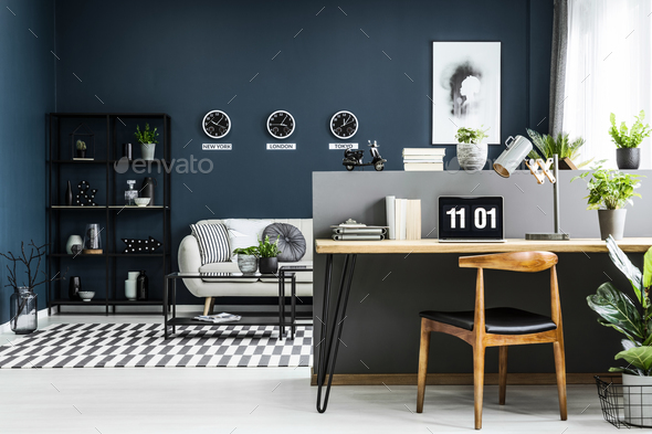 Open space home office interior with desk, chair, plants and mod Stock Photo by bialasiewicz