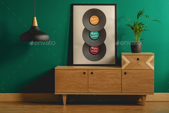 Framed poster on wooden dresser - Stock Photo - Images