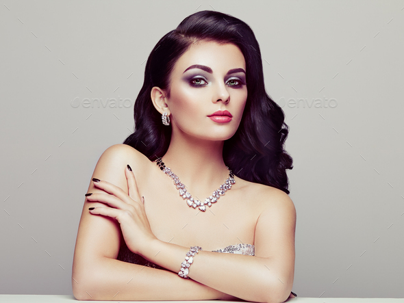 Brunette woman with long shiny wavy hair - Stock Photo - Images