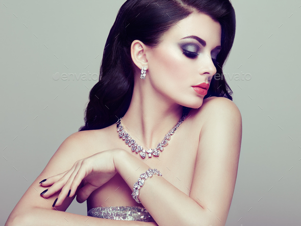 Brunette woman with long shiny wavy hair - Stock Photo - Images