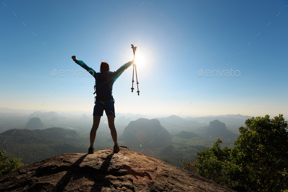 Successful hiker enjoy the view on mountain top - Stock Photo - Images