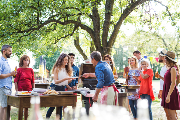 Family celebration or a barbecue party outside in the backyard. - Stock Photo - Images
