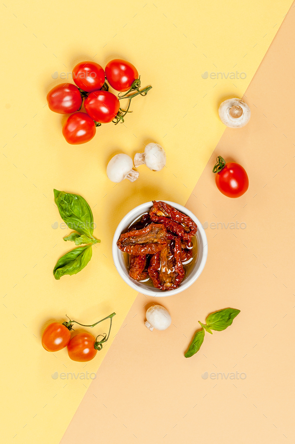 Sun dried tomatoes, champignon mushrooms, fresh tomatoes and bas - Stock Photo - Images