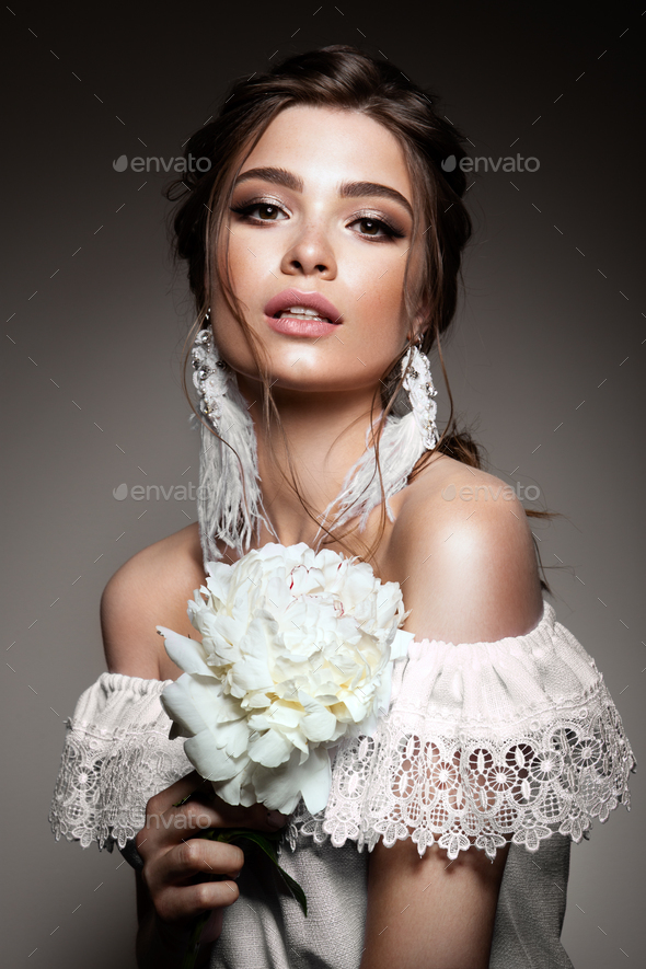 Glamour portrait of beautiful woman model with fresh daily makeup and romantic wavy hairstyle. - Stock Photo - Images