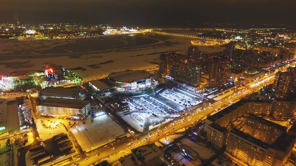 Large Festival Stage Among Lit Night City Aerial alt