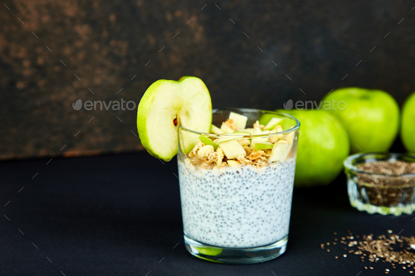 Healthy chia pudding with apples and granola in glass. - Stock Photo - Images