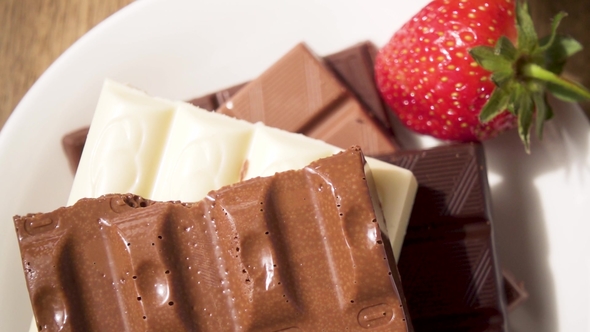 Chocolate and Strawberry Next To a Glass with Milkshake