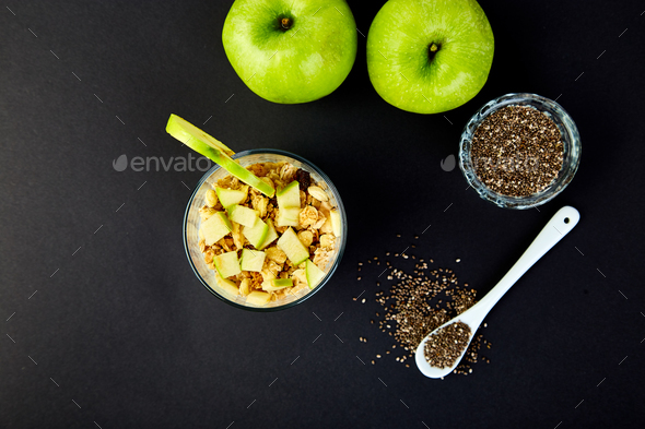 Healthy chia pudding with apples and granola in glass. - Stock Photo - Images