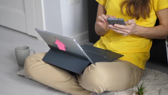 Young Businesswoman Browsing Internet on Smartphone at Work Place