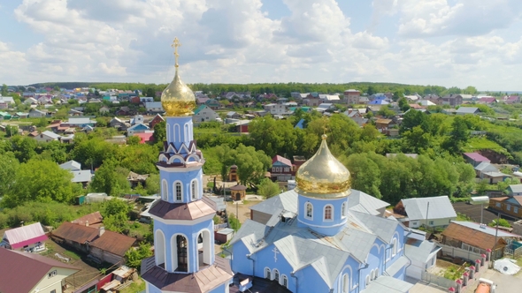 Religious Temple with Domes Shining Under Sun Rays alt