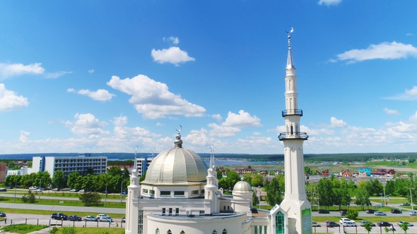 Muslim Temple in Front of Road Against City Buildings alt