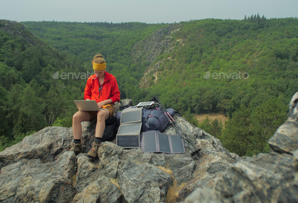 solar charging hiker - Stock Photo - Images