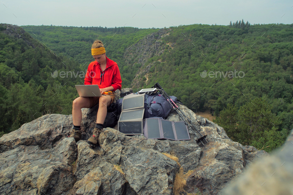 solar charging hiker - Stock Photo - Images
