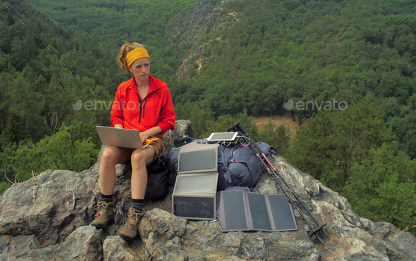 solar charging hiker - Stock Photo - Images