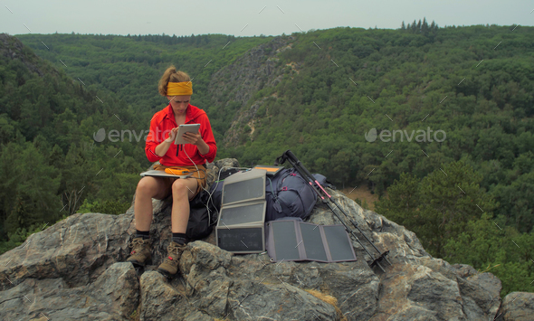 solar charging hiker - Stock Photo - Images