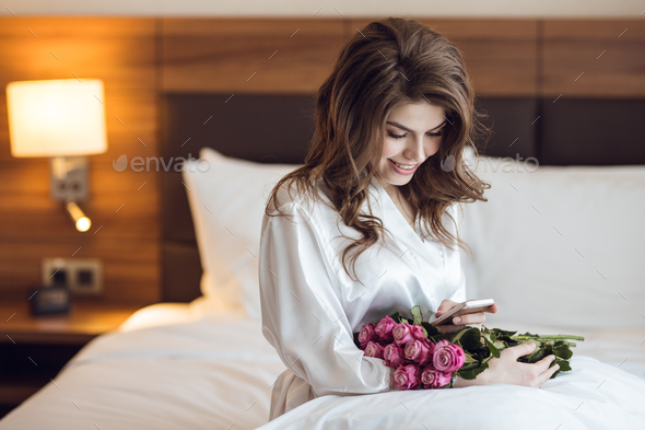 Smiling woman with bouquet of flowers Stock Photo by AboutImages | PhotoDune