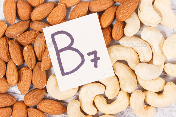 Nutritious almonds and cashew nuts containing vitamin B7 and dietary fiber, healthy nutrition - Stock Photo - Images