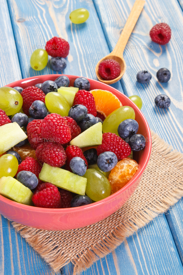 Fresh prepared fruit salad in glass bowl, healthy nutrition concept - Stock Photo - Images