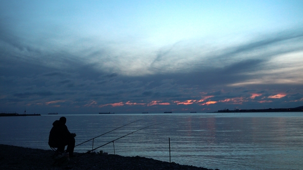 One Fisher Sits and Catches a Fish. alt