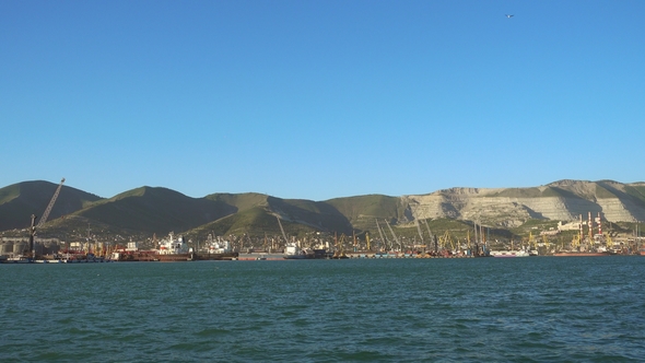 Large Russian Port Novorossiysk, Cargo and Oil Terminal. Cargo Ship Enters in  Port.
