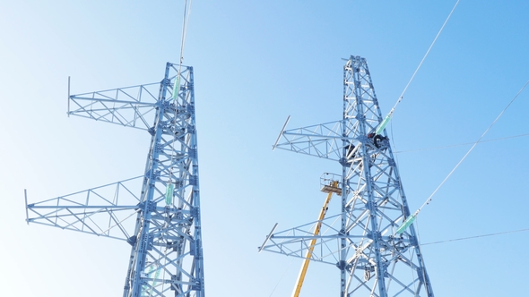 Transmission Towers and Crane Ground with Employee alt