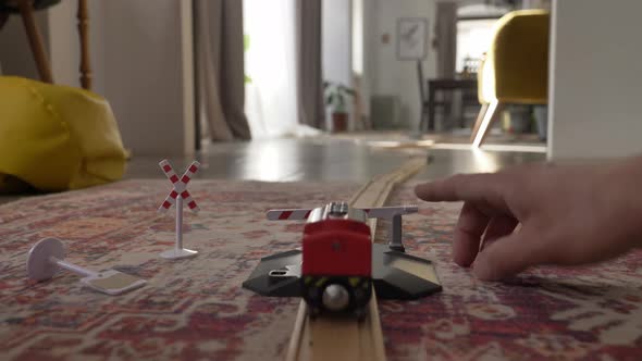 Little boy play in train in room at home alt