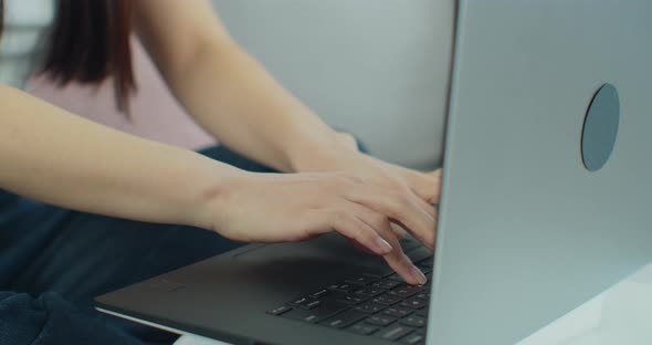 Female Hands of Woman Using Typing on Laptop Notebook Keyboard Sit at Home Online
