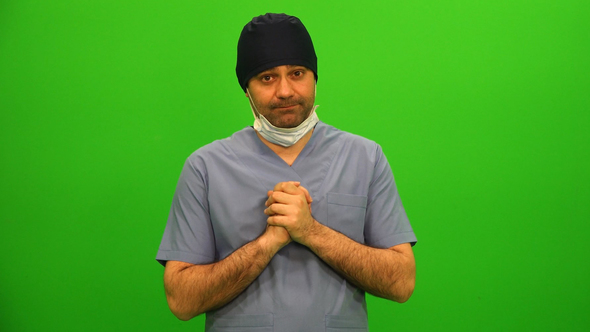 Surgeon Pulls Down Face Mask, Delivers Bad News