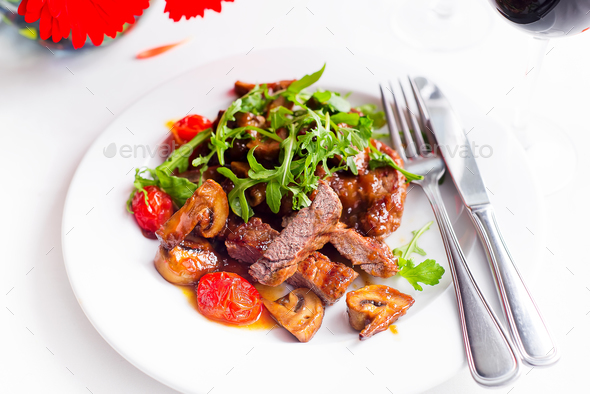 Juicy steak medium rare beef with spices and grilled vegetables. - Stock Photo - Images