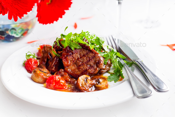 Juicy steak medium rare beef with spices and grilled vegetables. - Stock Photo - Images