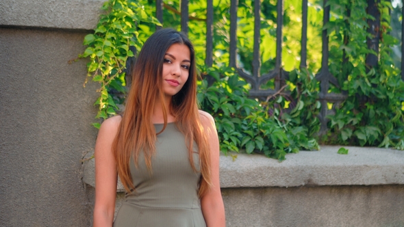 Portrait of Young Attractive Girl Smiling Outdoor alt
