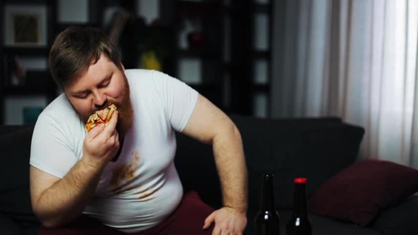 Weak-willed Overweight Man Eating Pizza and Drinking Beer Sitting on ...