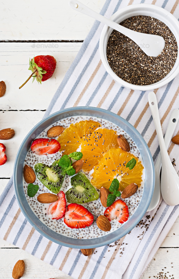 Vegan almond milk chia seeds pudding with strawberries, orange and kiwi. - Stock Photo - Images