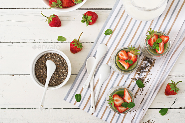 Vegan coconut milk chia seeds pudding with strawberries and kiwi. - Stock Photo - Images