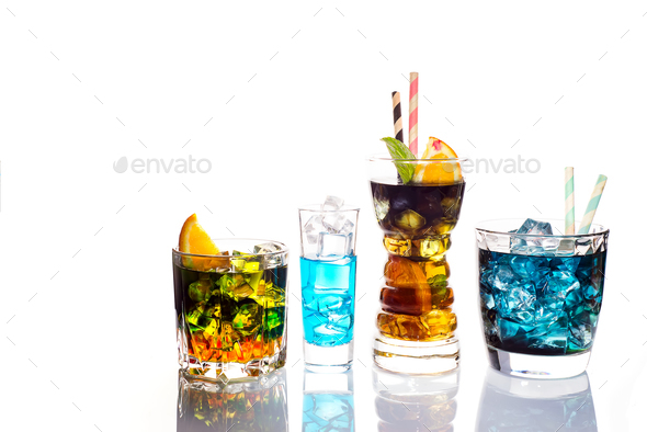 Selection of colorful festive drinks, alcoholic beverages and cocktails in elegant glasses on white - Stock Photo - Images