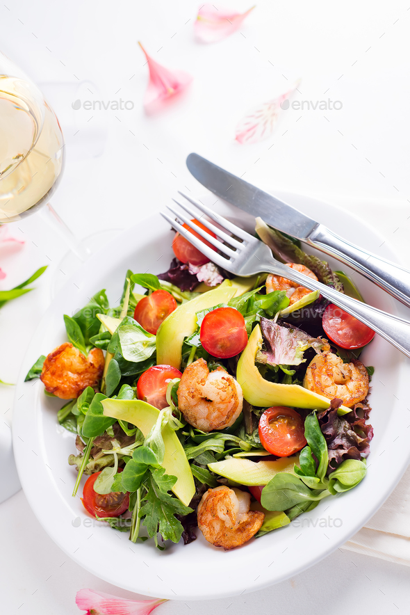 Fresh salad plate with shrimp, avocado, tomato and mixed greens - Stock Photo - Images