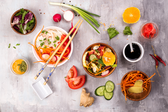 Spicy glass noodles with vegetables - carrots, cucumber, peppers, garlic. - Stock Photo - Images