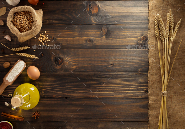 ears of wheat and bakery ingredients on wood Stock Photo by seregam