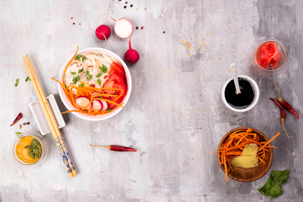 Spicy glass noodles with vegetables - carrots, cucumber, peppers, garlic. - Stock Photo - Images