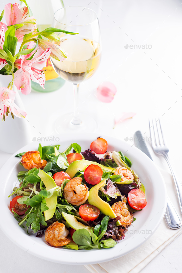 Fresh salad plate with shrimp, avocado, tomato and mixed greens - Stock Photo - Images