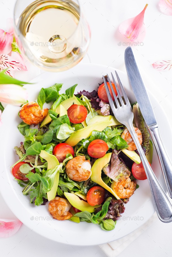 Fresh salad plate with shrimp, avocado, tomato and mixed greens - Stock Photo - Images