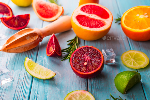 Pattern of slice citrus on blue wooden background - Stock Photo - Images