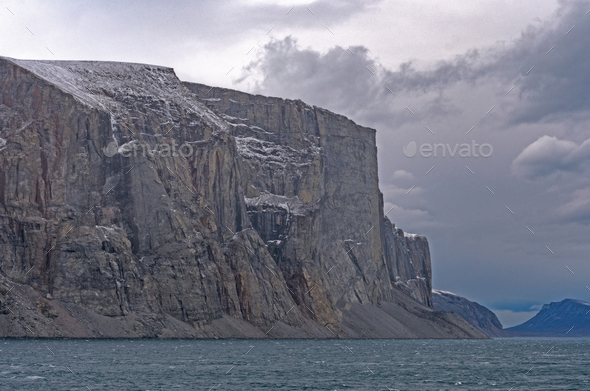 Dramatic Cliffs Guarding the Fjord - Stock Photo - Images