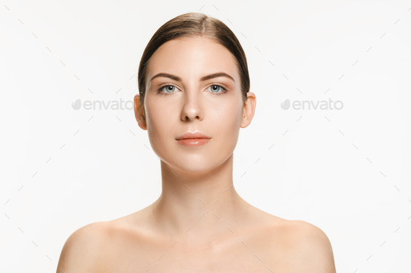 Beautiful face of young adult woman with clean fresh skin isolated on white - Stock Photo - Images