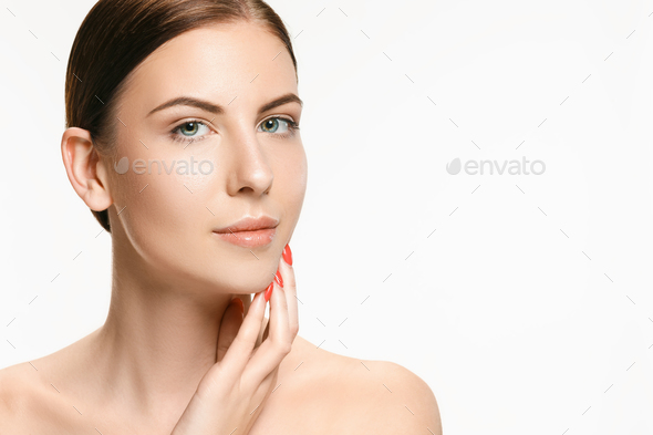 Beautiful face of young adult woman with clean fresh skin isolated on white - Stock Photo - Images