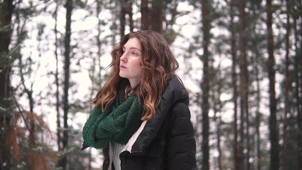 Portrait of a Strange and Mysterious Red-haired Girl in a Winter Forest alt