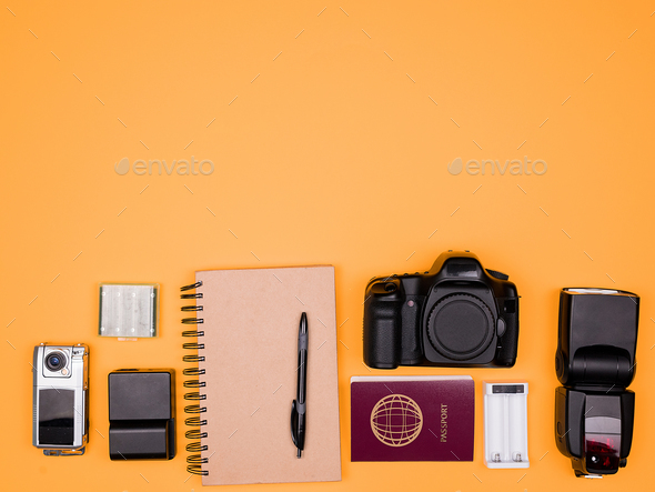 Flatlay accesories of a travel blogger on pastel orange background - Stock Photo - Images