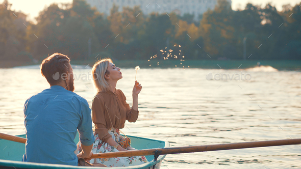Young couple in a boat Stock Photo by AboutImages | PhotoDune